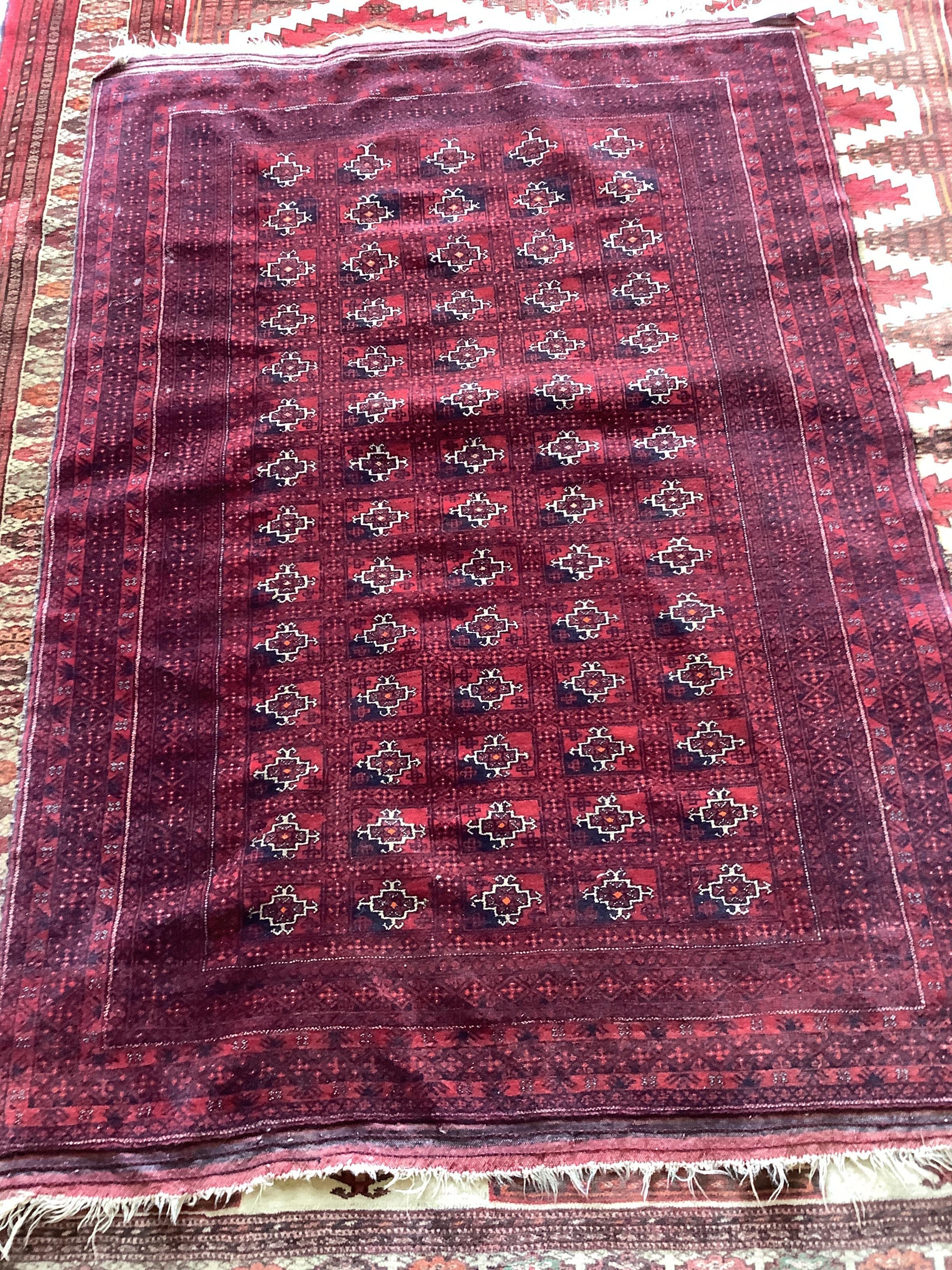 A Bokhara red ground rug, 150 x 104cm